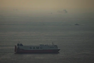 Cargo ships sail in the Arabian Gulf towards Strait of Hormuz in United Arab Emirates, March 19, 2026.