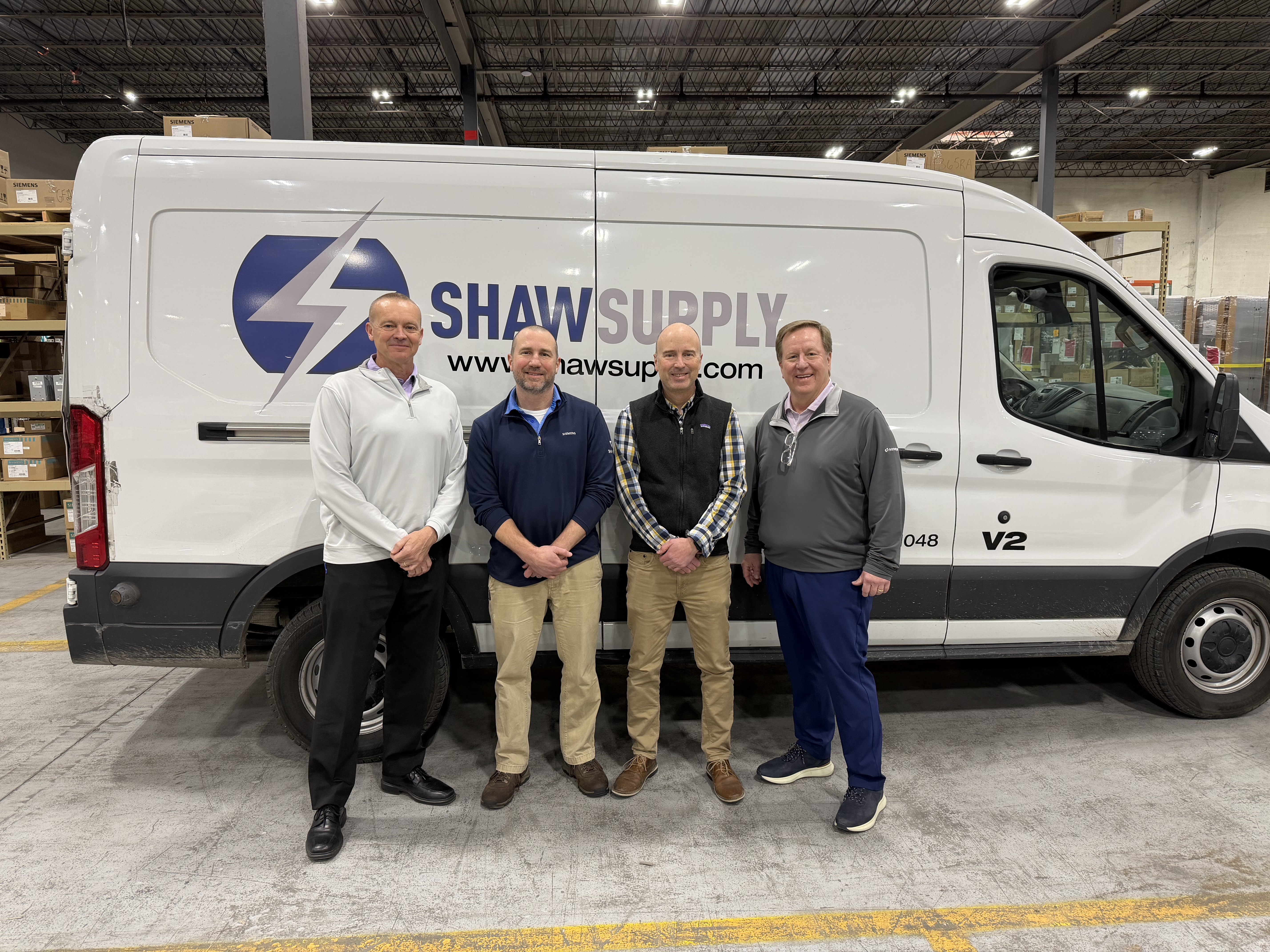 Echo Electric President Chris Scarbrough with Shaw Supply co-owners Brian and Patrick Shaw and Sonepar USA Central Region President Andy Waring.