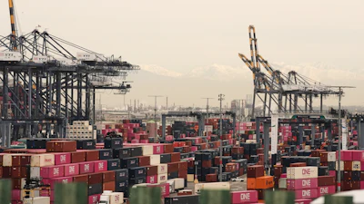 Containers are stacked at the Port of Los Angeles Friday, Feb. 20, 2026, in Los Angeles.