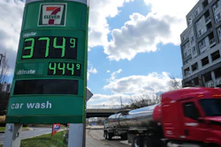 Fuel prices at a Baltimore gas station as a fuel truck drives by, March 17, 2026.