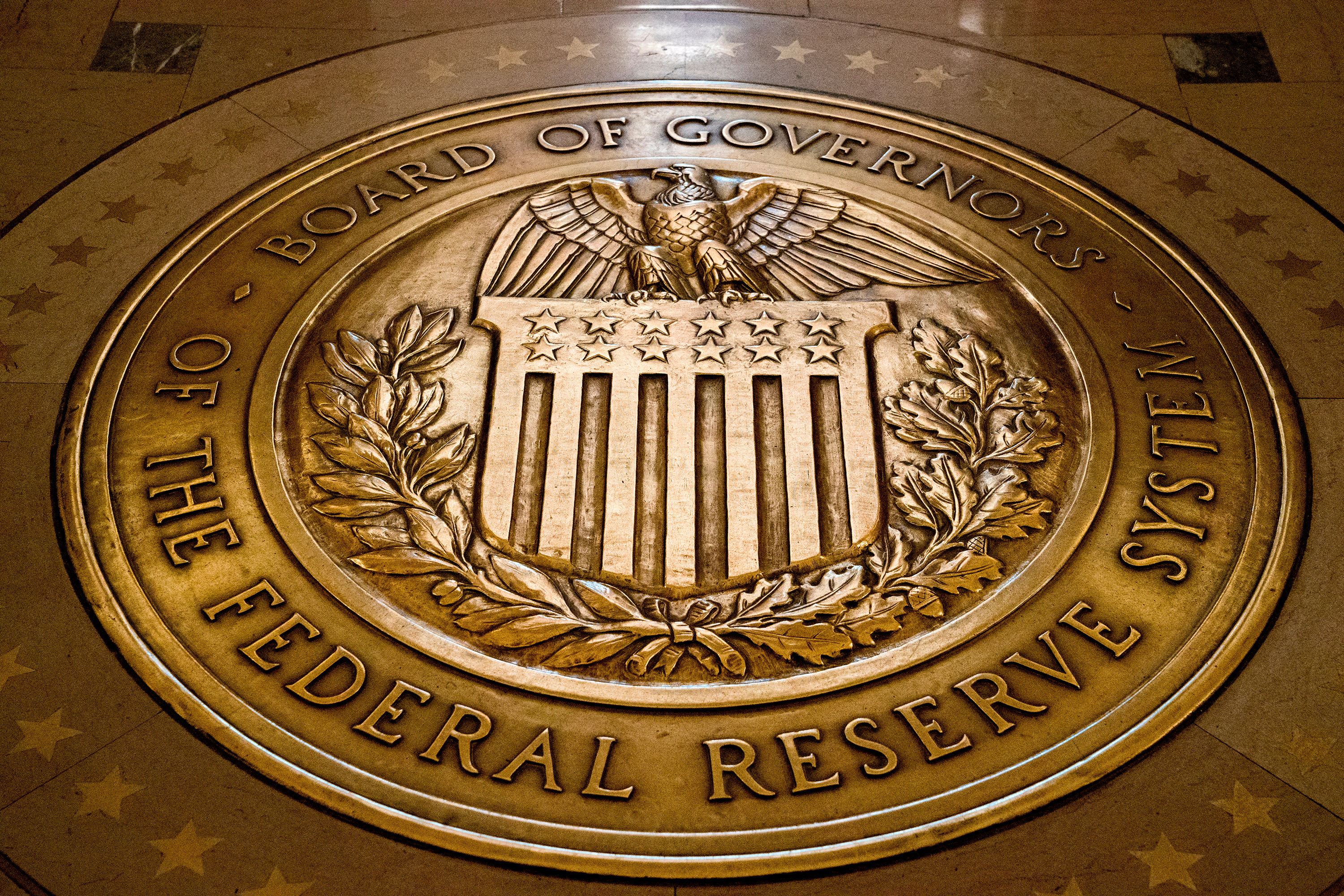 The seal of the Board of Governors of the United States Federal Reserve System is displayed in the ground at the Marriner S. Eccles Federal Reserve Board Building in Washington, Feb. 5, 2018.