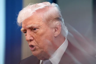 A zoom lens and slow shutter speed technique shows President Donald Trump speaking with reporters in the James Brady Press Briefing Room at the White House, April 6, 2026.