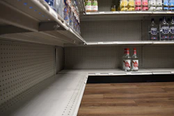 A shelf stands partially empty at Spillway Wine and Spirits in Brandon, Miss., April 16, 2026.
