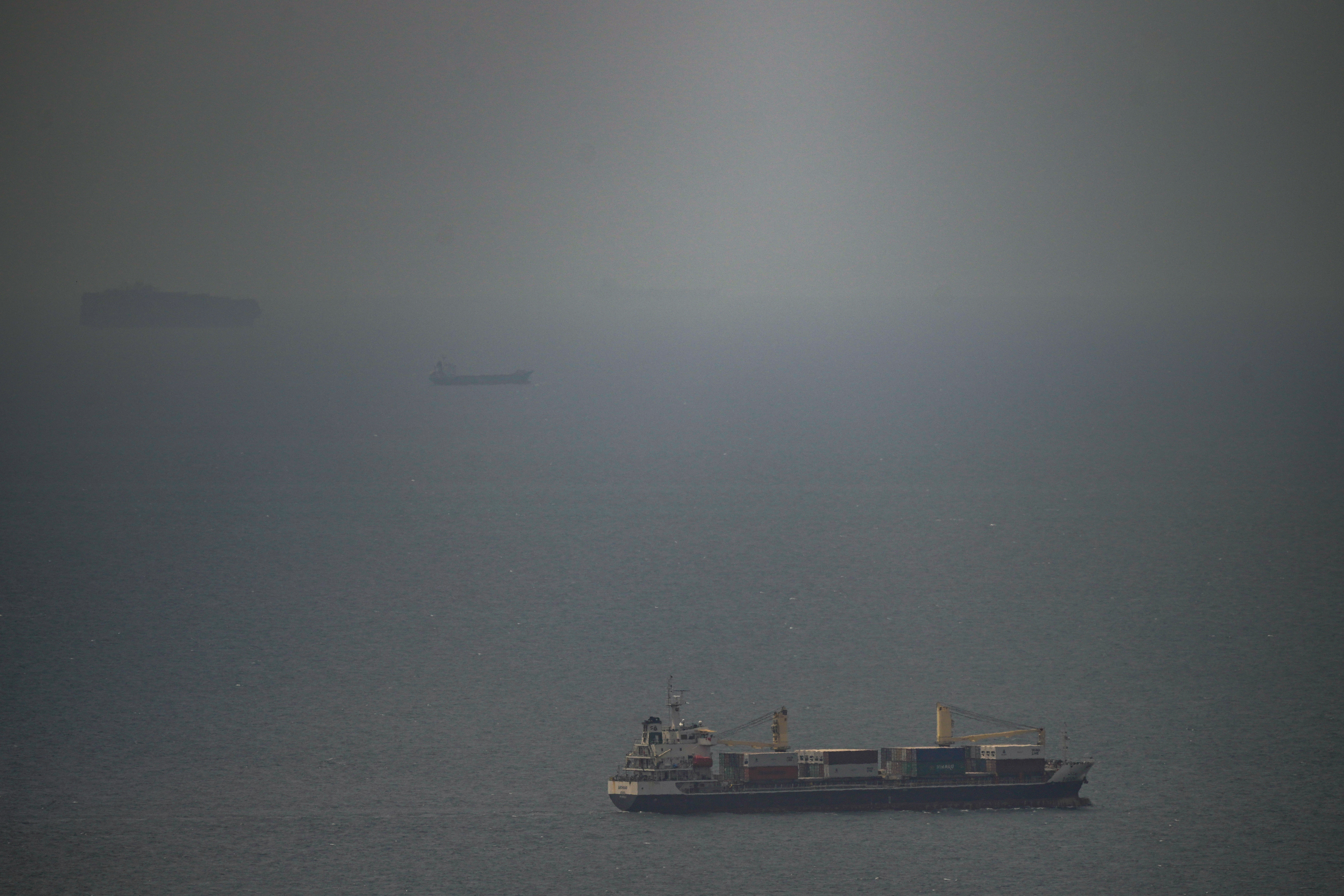 A cargo ship sails in the Persian Gulf toward the Strait of Hormuz, April 22, 2026.