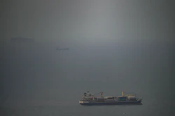 A cargo ship sails in the Persian Gulf toward the Strait of Hormuz, April 22, 2026.