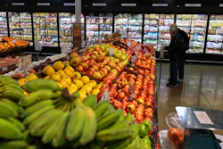 People shop at a grocery store, in Schaumburg, Ill., Thursday, April 2, 2026.