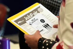 A job seeker waits to talk to a recruiter at a job fair Aug. 28, 2025, in Sunrise, Fla.
