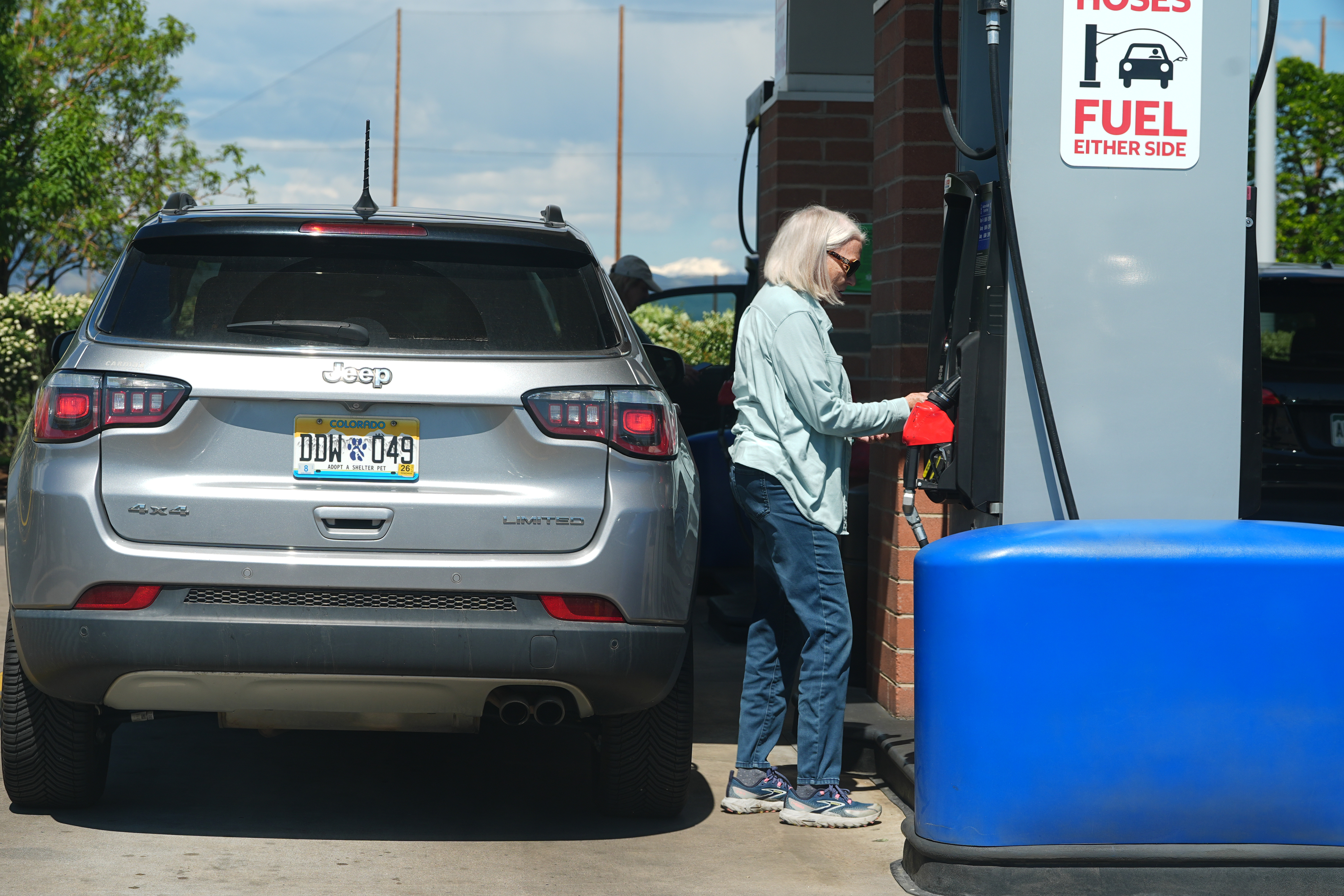 A motorist swipes a credit card at a gas station, May 24, 2026, Sheridan, Colo.