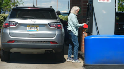 A motorist swipes a credit card at a gas station, May 24, 2026, Sheridan, Colo.
