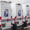 USPS delivery vans in Denver, March 23, 2026.