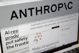 Pages from the Anthropic website and the company's logo are displayed on a computer screen in New York, Feb. 26, 2026.