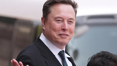Elon Musk departs after a welcome ceremony with President Donald Trump and China's President Xi Jinping at the Great Hall of the People, May 14, 2026, Beijing.