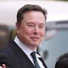 Elon Musk departs after a welcome ceremony with President Donald Trump and China's President Xi Jinping at the Great Hall of the People, May 14, 2026, Beijing.