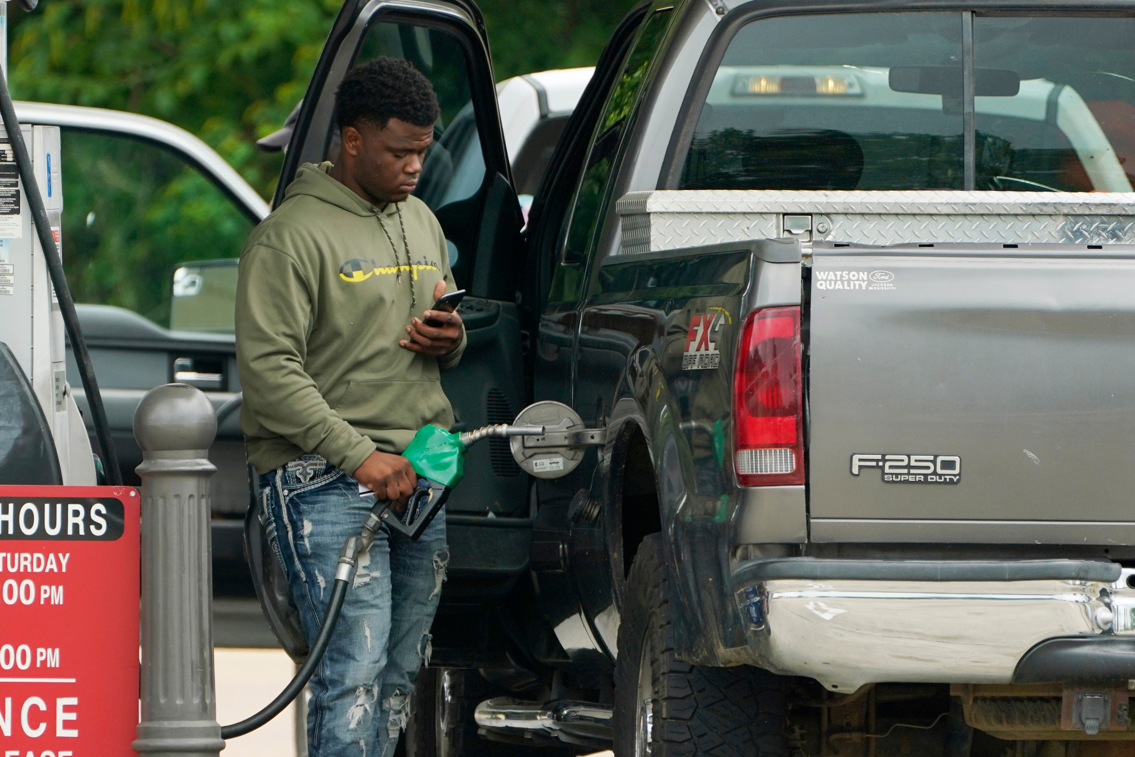 A customer prepares to pump fuel at a Sam's Club, Madison, Miss., May 24, 2022.