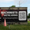 A hiring sign is seen outside of a company in Wheeling, Ill., Monday, June 8, 2026.