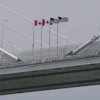 Canadian and American flags on the Gordie Howe Bridge between Windsor, Ontario and Detroit, May 22, 2026.