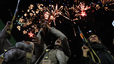 Fireworks burst as Houthi supporters rally against the Saudi-led coalition in Sanaa, Yemen, July 20, 2026.