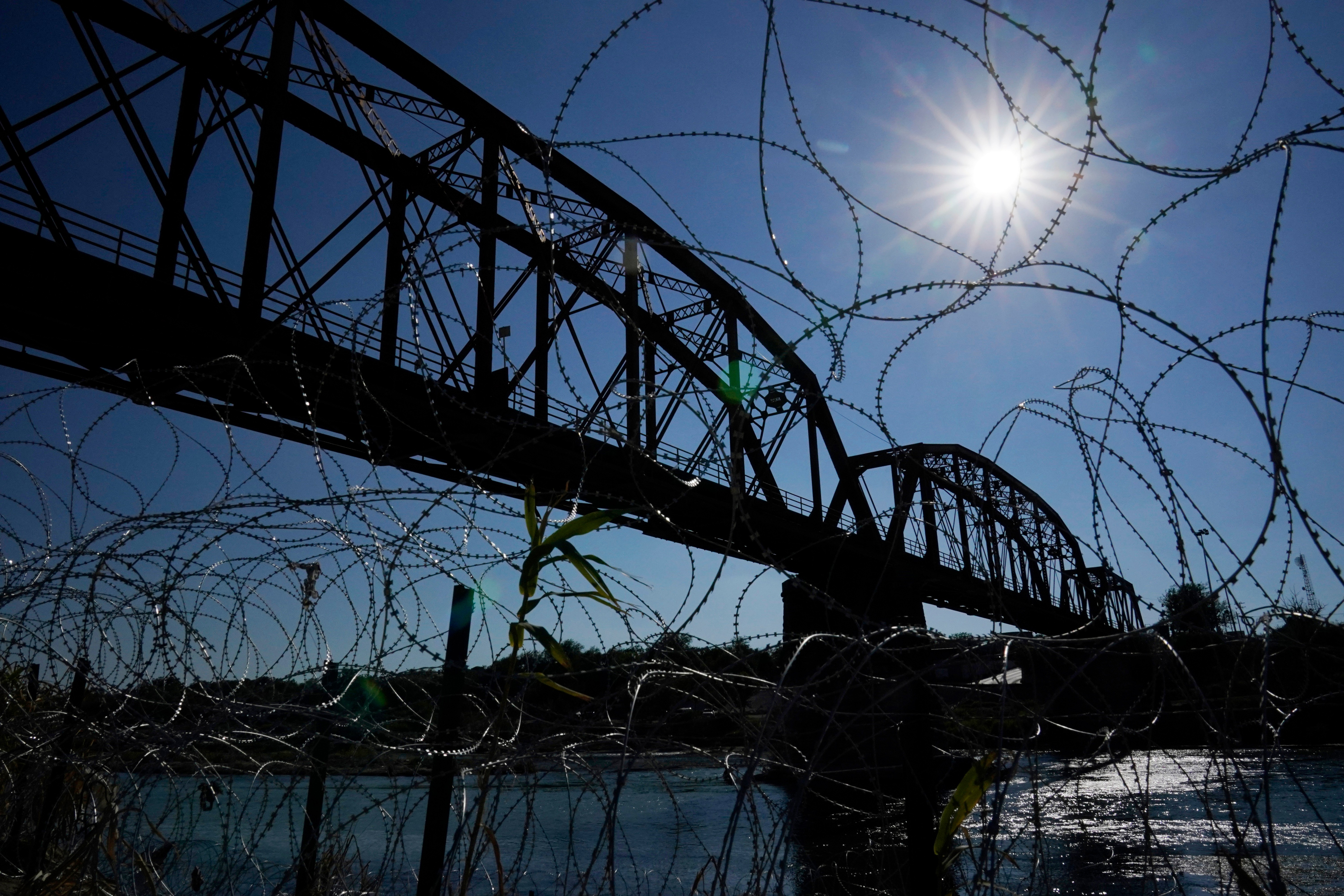 The Union Pacific International Railroad Bridge is seen behind concertina wire, Eagle Pass, Texas, Sept. 22, 2023.