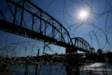 The Union Pacific International Railroad Bridge is seen behind concertina wire, Eagle Pass, Texas, Sept. 22, 2023.