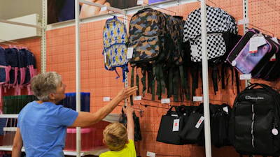 Shoppers look at backpacks at a Target store, Aug. 13, 2026, Woodbury, Minn.