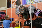 Shoppers look at backpacks at a Target store, Aug. 13, 2026, Woodbury, Minn.