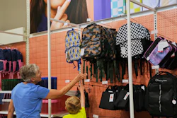 Shoppers look at backpacks at a Target store, Aug. 13, 2026, Woodbury, Minn.