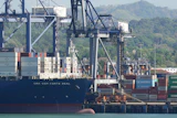 Cranes load a cargo ship at the Panama Canal's Port of Balboa, Panama City, Jan. 30, 2026.