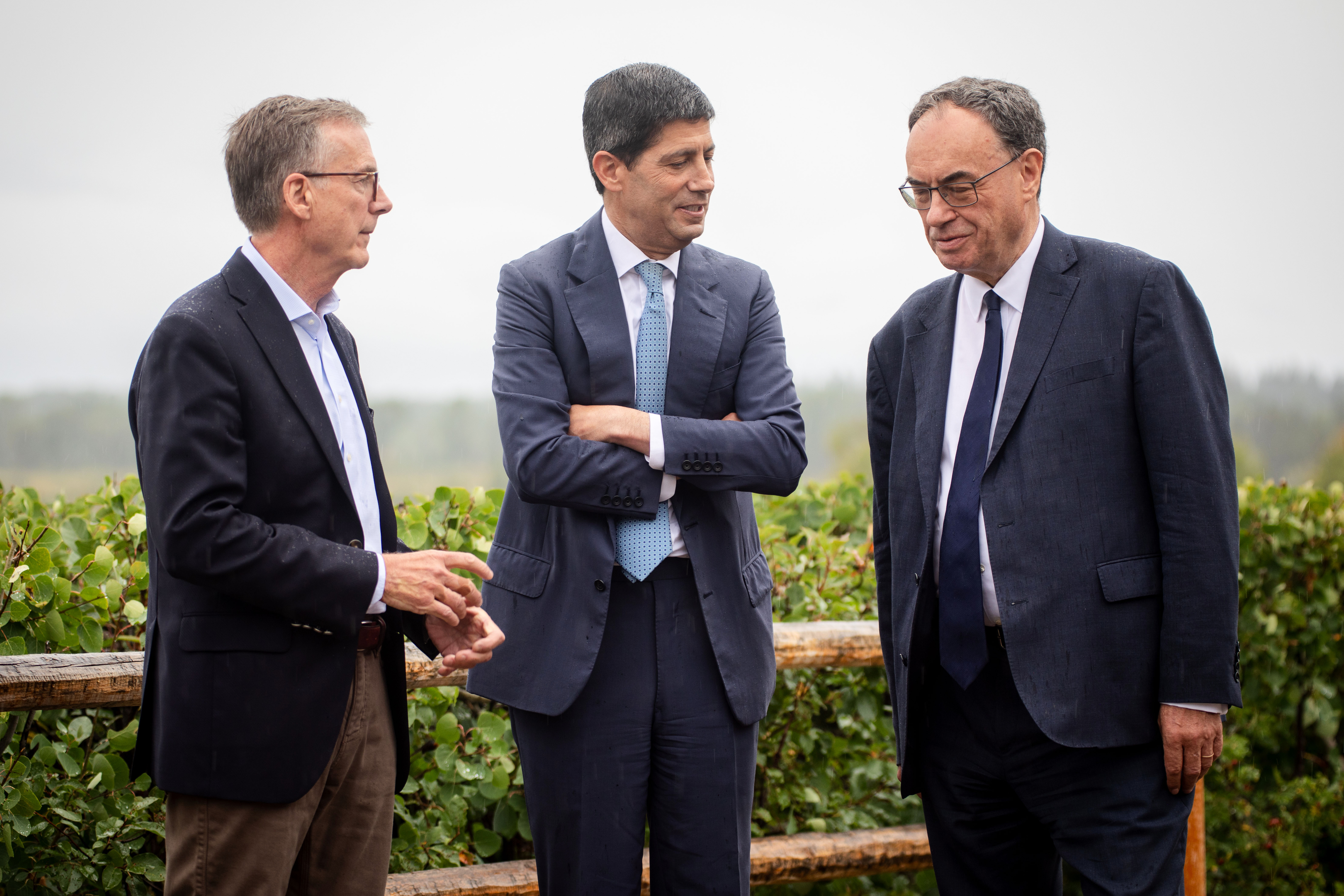 Fed Chair Kevin Warsh, center, talks to Bank of England Governor Andrew Bailey, right, and Bank of Canada Governor Tiff Macklem at the annual Jackson Hole Economic Policy Symposium, Aug. 28, 2026, Moran, Wyo.