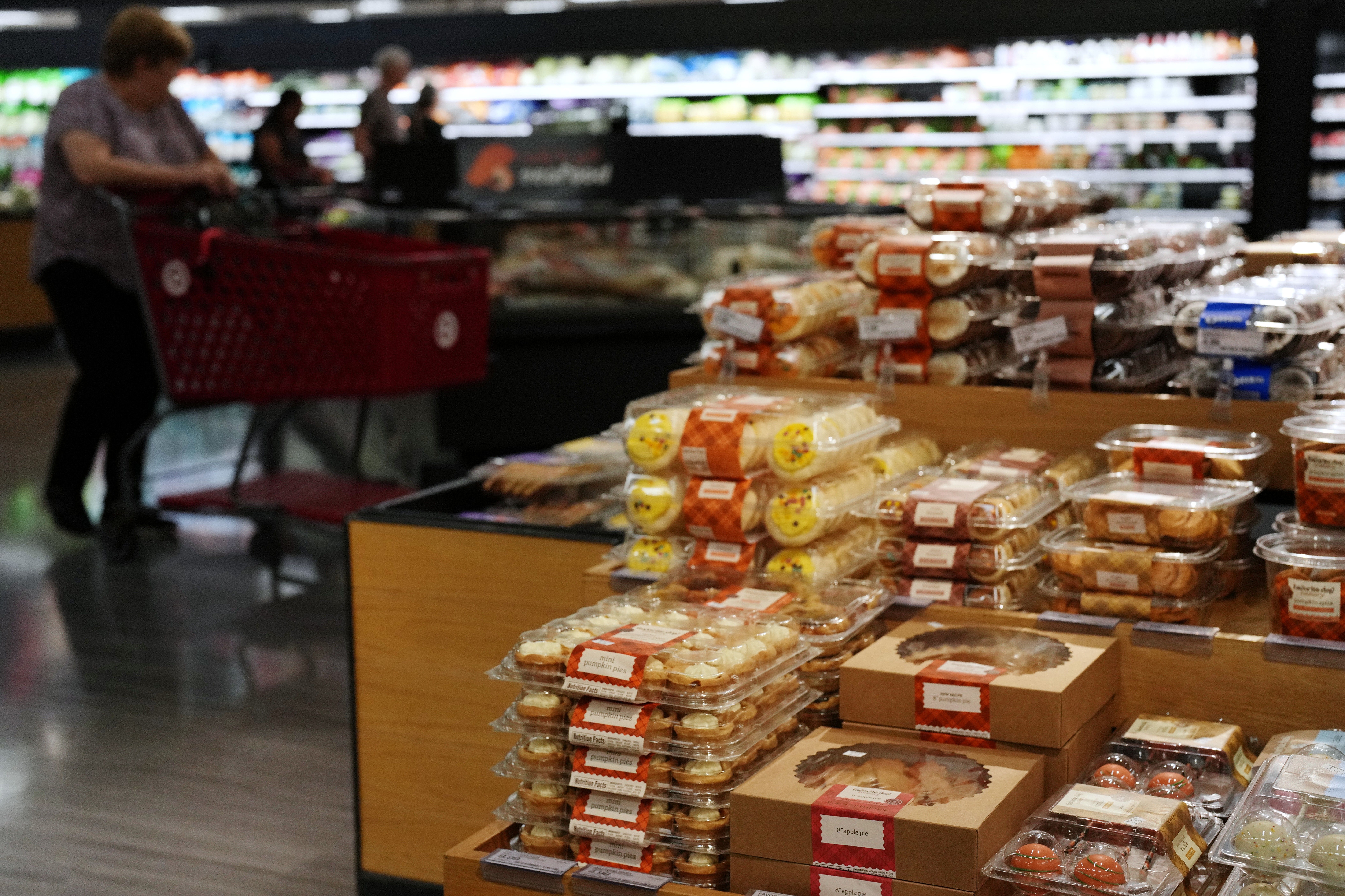 Shoppers pass through the bakery section at a Target store, Aug. 13, 2026, Woodbury, Minn.