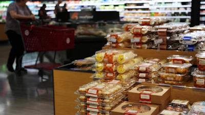 Shoppers pass through the bakery section at a Target store, Aug. 13, 2026, Woodbury, Minn.
