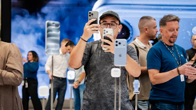 People shop at the Apple store on Fifth Avenue on the day of Apple's launch of the iPhone 18 Pro, Sept. 18, 2026, New York.