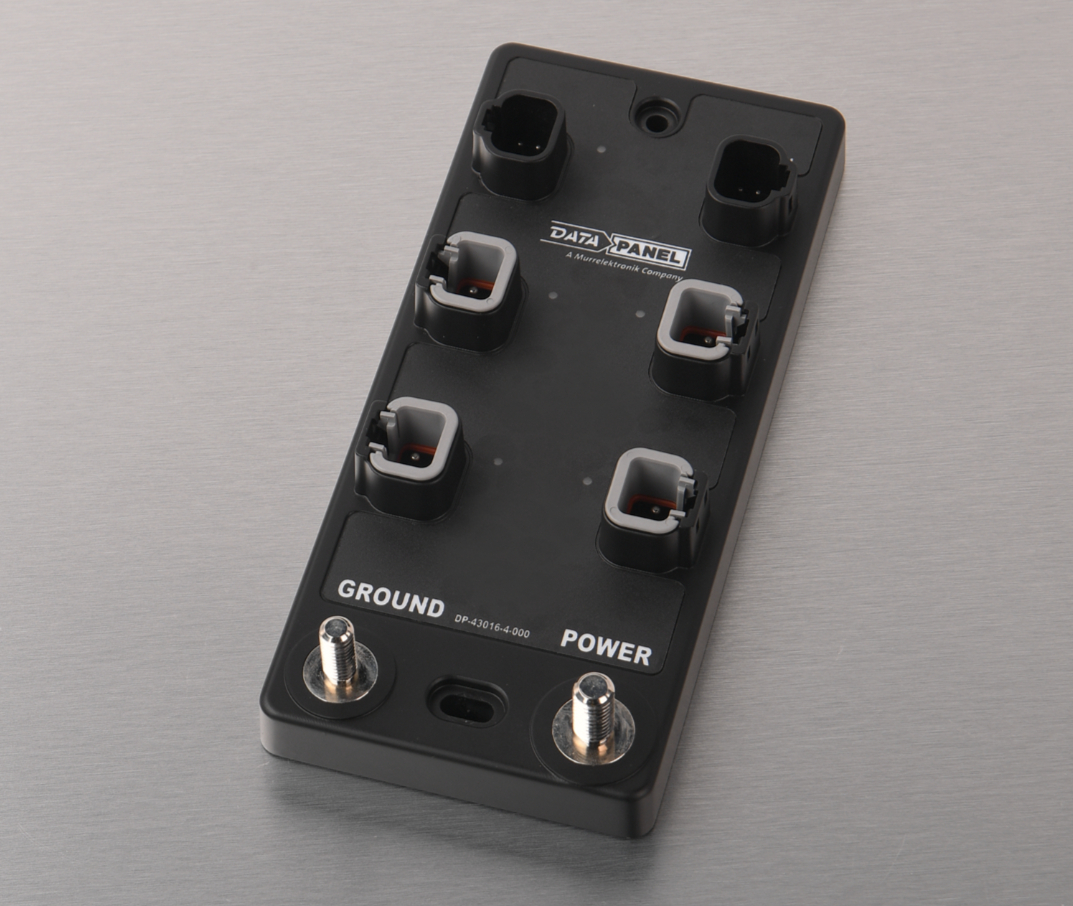 Black data panel control device with four toggle switches and two rotary knobs for ground and power settings