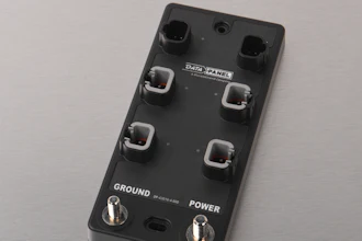 Black data panel control device with four toggle switches and two rotary knobs for ground and power settings