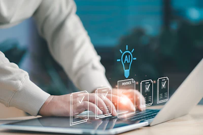 Professional using laptop with holographic AI and invoice management interface overlay