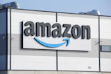 Amazon logo on industrial warehouse building exterior signage