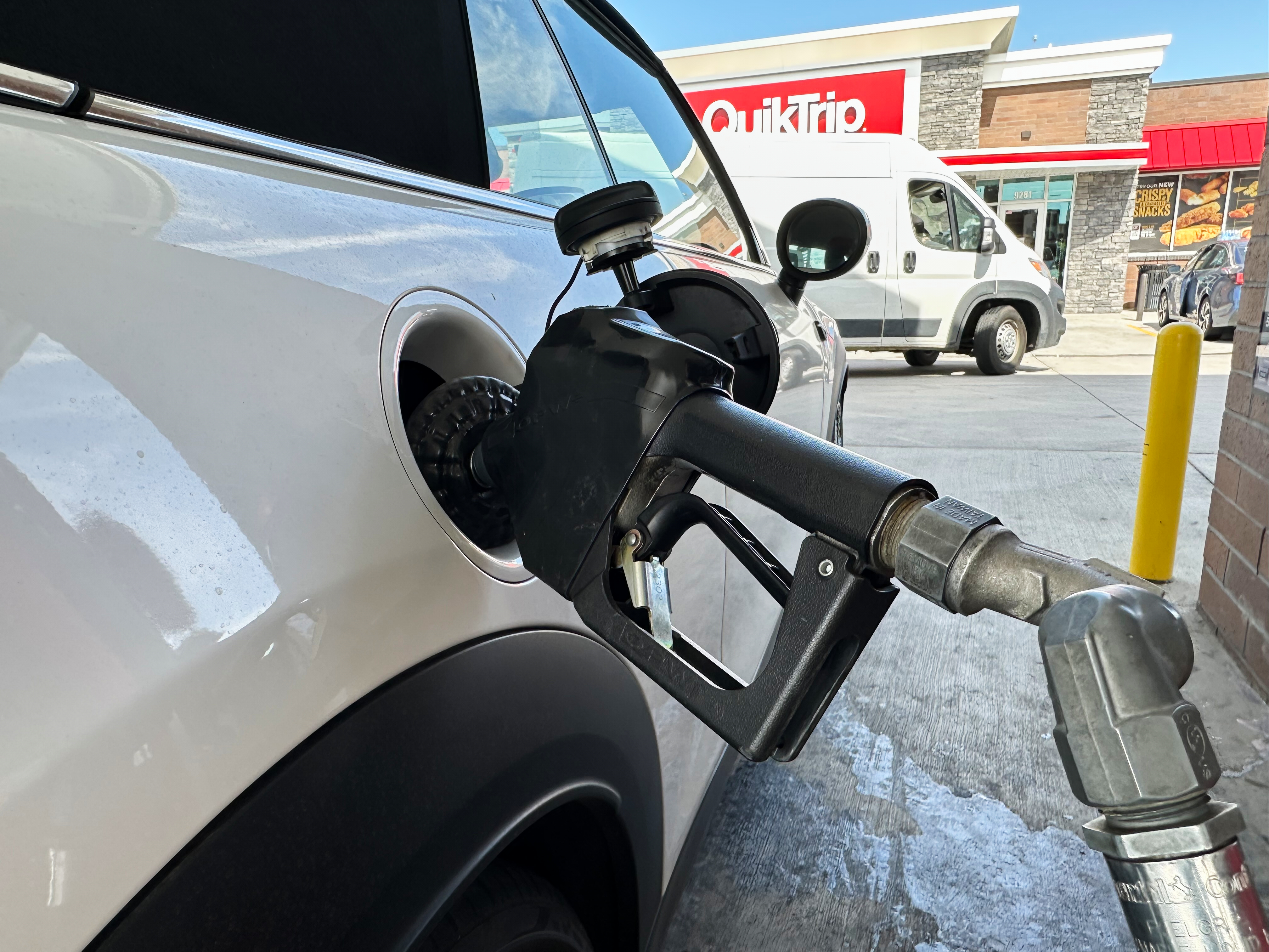 A motorist fills up at a QuikTrip gas station, Sept. 15, 2026, Greenwood Village, Colo.
