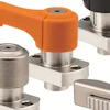 Industrial toggle clamps with stainless steel and colored handles in orange and black