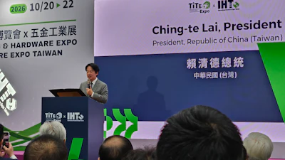 Speaker presenting at TITE and IHE Expo 2026 conference podium with event signage displaying Taiwan president information